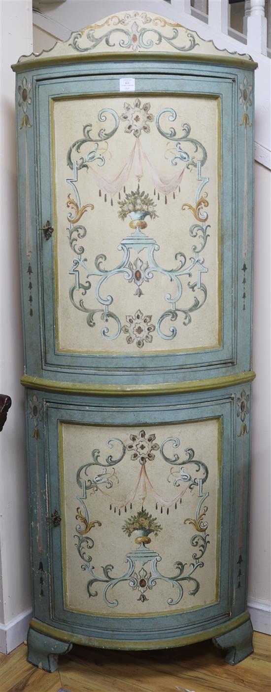 An Italian 18th century design painted bowfronted standing corner cupboard